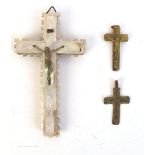 A mid-19th century horn and gilt metal crucifix and two others.