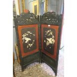 AN ORIENTAL EBONISED AND LACQUERED TWO FOLD SCREEN overlaid with birds and foliage 151cm (h) each