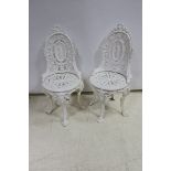 A PAIR OF VICTORIAN DESIGN CAST IRON PATIO CHAIRS,