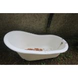 A CAST IRON AND WHITE ENAMEL SLIPPER BATH,