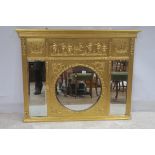 A GILTWOOD AND GESSO COMPARTMENTED OVER MANTEL MIRROR the frieze moulded in leaf with frolicking