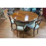 A FINE 19TH CENTURY ROSEWOOD DINING ROOM SUITE comprising six chairs each with a pierced carved top