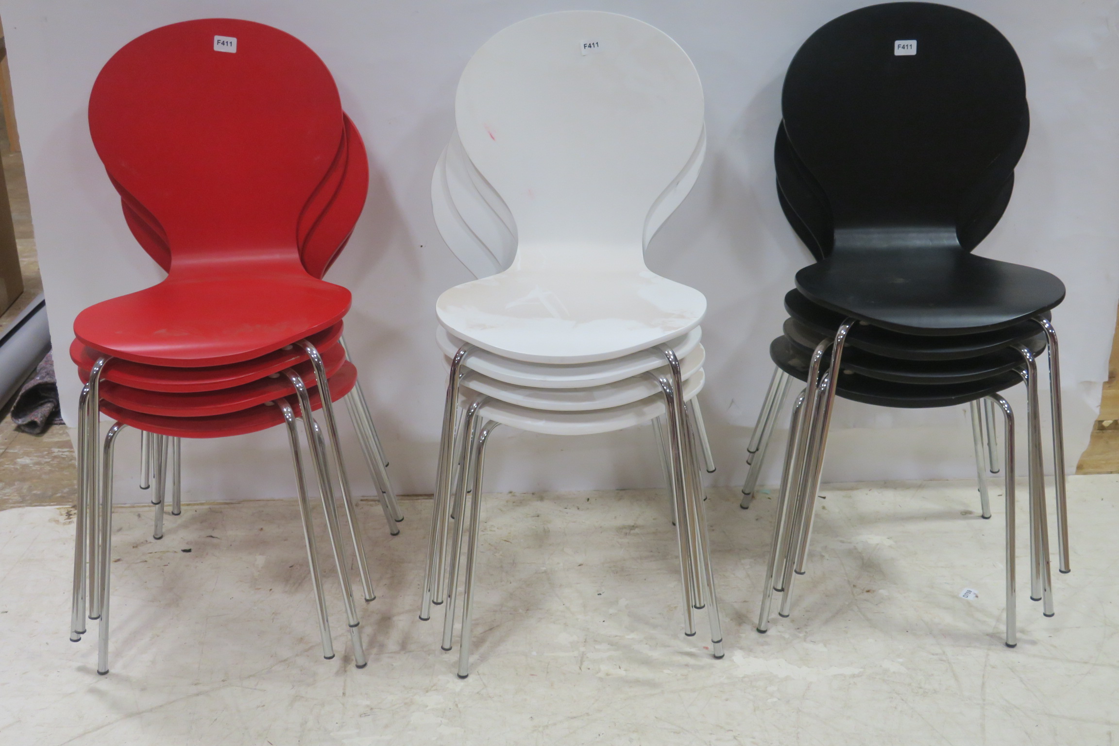 A SET OF TWELVE BENTWOOD CHAIRS each with shaped back and seat on chrome legs comprising four white