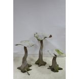 THREE WOODEN MUSHROOMS each on naturalistic form