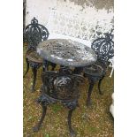 A VICTORIAN DESIGN THREE PIECE CAST IRON PATIO SUITE,