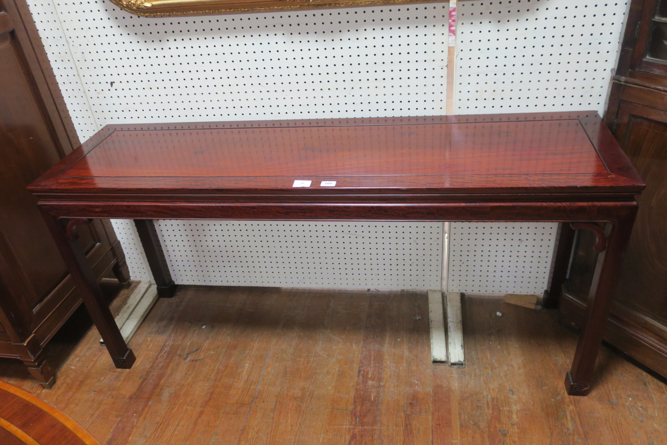 AN ORIENTAL ROSEWOOD SIDE TABLE of rectangular outline with shaped frieze on square moulded legs