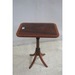 A SHERATON DESIGN ROSEWOOD AND SATINWOOD CROSS BANDED WINE TABLE