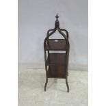 AN EDWARDIAN ROSEWOOD AND SATINWOOD INLAID THREE TIERED CAKE STAND of square form on splayed legs