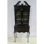 A CHIPPENDALE DESIGN MAHOGANY DISPLAY CABINET the swan neck pediment above a pair of astragal