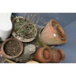 TWO PAIRS OF TERRACOTTA PLANTERS together with three similar examples and a moulded stone pedestal