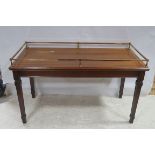 A PAIR OF 19TH CENTURY MAHOGANY AND BRASS MILLINER'S TABLES each of rectangular form with brass