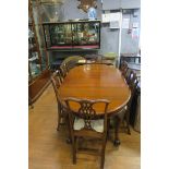 A CHIPPENDALE DESIGN MAHOGANY SEVEN PIECE DINING SUITE comprising six chairs each with a pierced
