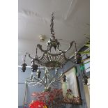 A 19TH CENTURY SILVER PLATED SIX BRANCH CENTRE LIGHT with pierced dish and scroll arms with foliate