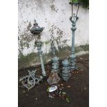 THREE CAST IRON STANDARD LAMPS each with a reeded column above a baluster pedestal together with