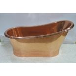 A FINE COPPER BATH TUB of oval outline raised on plinth support 75cm (h) x 75cm (w) x 70cm (d)