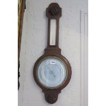 AN OAK CASED BANJO BAROMETER with silver dial