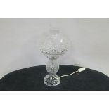 A WATERFORD CUT GLASS TABLE LAMP of baluster form with globe shade on a spreading foot 41cm (h)