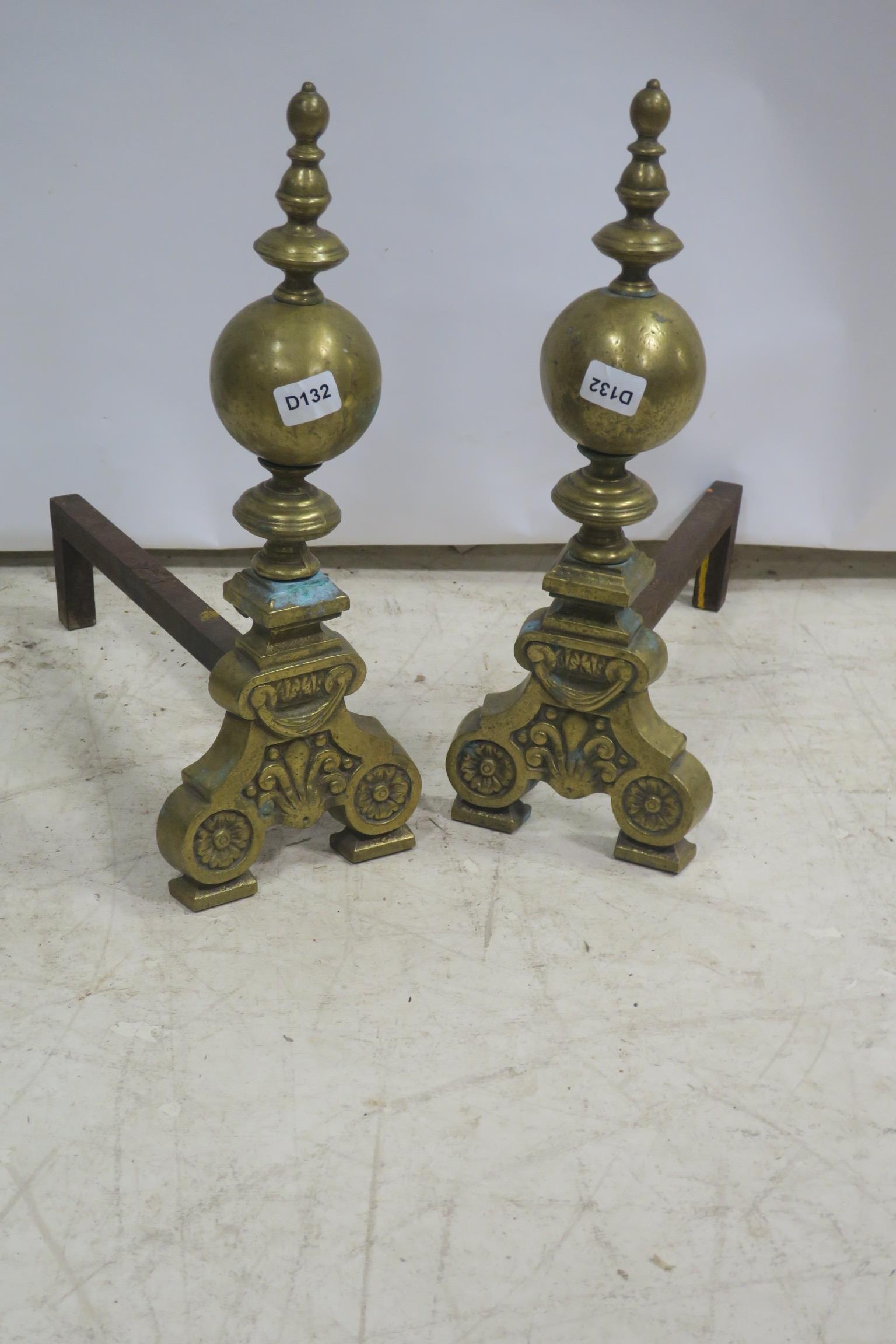 A PAIR OF 19th CENTURY CAST BRASS FIRE DOGS,