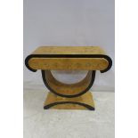 AN ART DECO DESIGN WALNUT CONSOLE TABLE the shaped top above two frieze drawers raised on a
