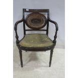 A 19TH CENTURY HEPPLEWHITE DESIGN CARVED MAHOGANY ELBOW CHAIR with bergere panelled back above an
