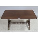 A REGENCY DESIGN MAHOGANY COFFEE TABLE of rectangular outline on lyre supports with splayed legs