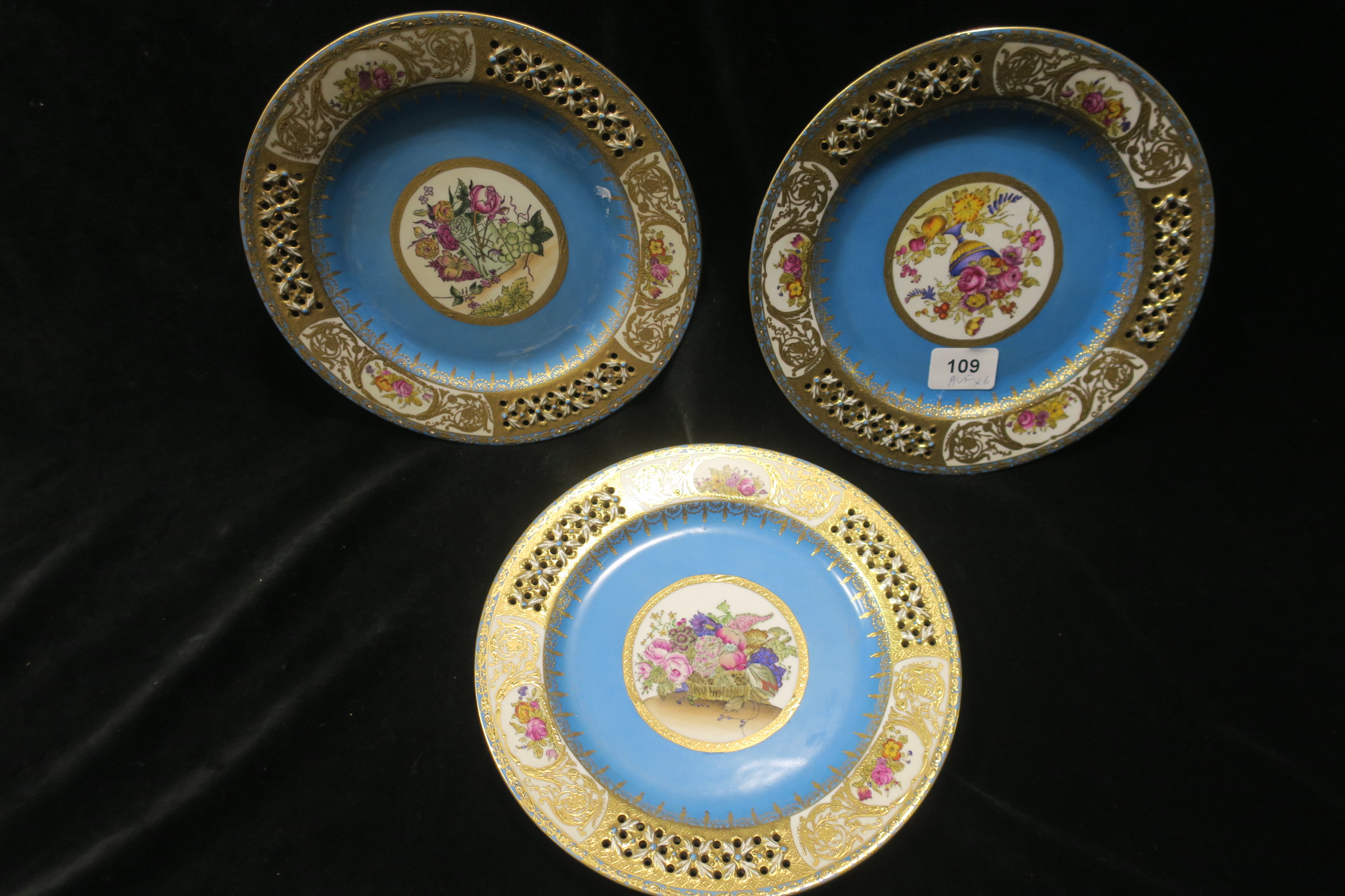 SIX CONTINENTAL PORCELAIN CABINET PLATES the turquoise and gilt ground with pierced border centred