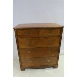 A MAHOGANY CHEST the rectangular top above two short and three long full front drawers with brass
