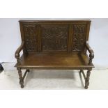 A GOOD 19TH CENTURY OAK BENCH the rectangular back with carved panels above a panelled seat with