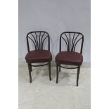 A SET OF SIX BENTWOOD CHAIRS each with a curved top rail and shaped splat with upholstered seats on