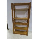 A PINE FIVE TIER OPEN FRONT BOOKSHELF