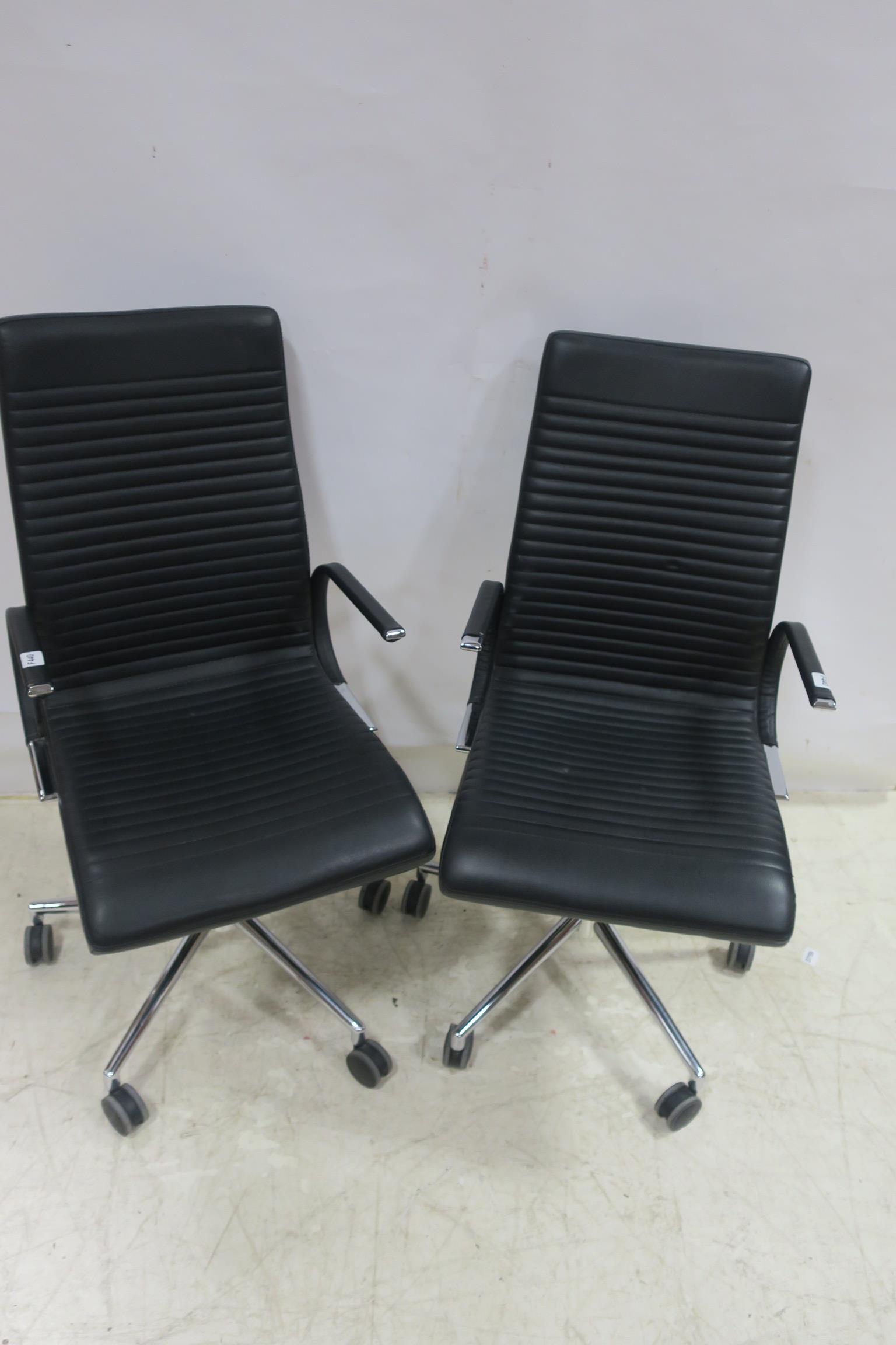 A SET OF THREE DANISH BO CONCEPT BLACK UPHOLSTERED AND CHROME SWIVEL ELBOW CHAIRS