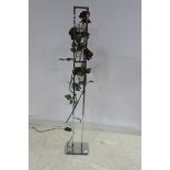 A DESIGNER CHROME THREE TIER FLOOR STANDARD LAMP intertwined with roses together with a wrought