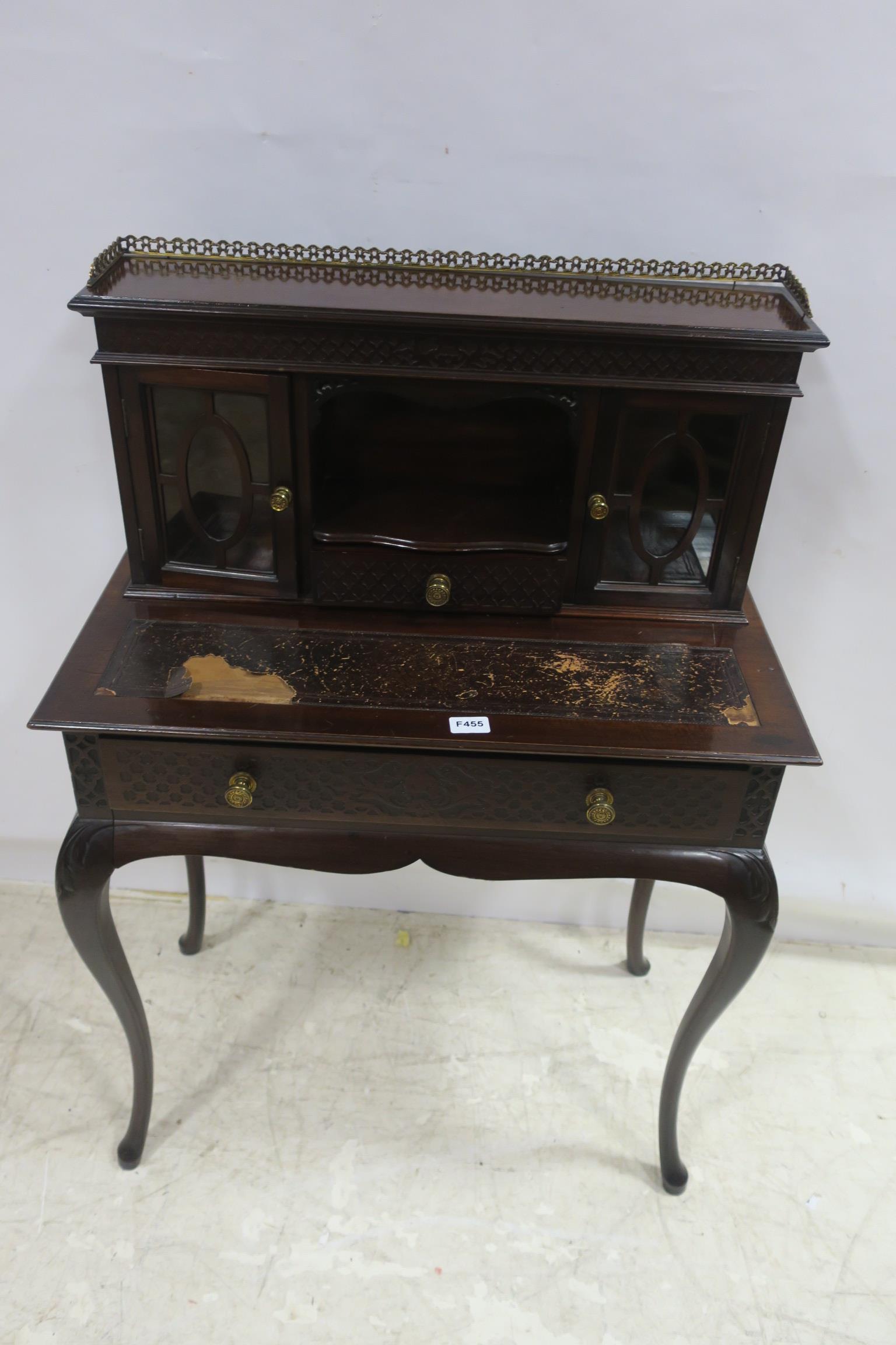 A 19TH CENTURY MAHOGANY DESK the superstructure with pierced brass gallery and glazed doors and