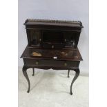 A 19TH CENTURY MAHOGANY DESK the superstructure with pierced brass gallery and glazed doors and