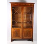 A 19TH CENTURY MAHOGANY AND SATINWOOD INLAID DISPLAY CABINET the moulded cornice above a pair of