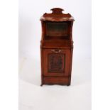 A 19TH CENTURY MAHOGANY FUEL BIN the superstructure with serpentine moulded shelf above a bevelled