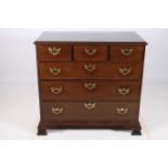 A FINE GEORGIAN MAHOGANY CHEST of rectangular outline the shaped top above three short and three