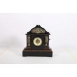 A 19TH CENTURY BLACK AND ROUGE MARBLE MANTEL CLOCK of architectural form with gilt brass mounts on