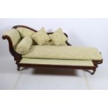 A 19TH CENTURY AND MAHOGANY UPHOLSTERED CHAISE LONGUE the serpentine carved top rail with