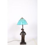 AFTER MILLIARD A SPELTER FIGURAL TABLE LAMP modelled as Siffleur shown standing on a naturalistic