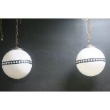 A PAIR OF VINTAGE CENTRE LIGHTS each of bulbous form the opaline shade with gilt brass band THE
