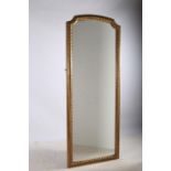 A 19TH CENTURY GILTWOOD AND GESSO MIRROR the rectangular shaped plate within an egg and dart