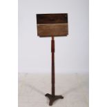 A MAHOGANY AND OAK ADJUSTABLE EASEL the rectangular stand above a ring turned column on a cast iron