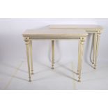 A FINE PAIR OF REGENCY DESIGN POLYCHROME AND GILT MOUNTED CONSOLE TABLES each surmounted with a