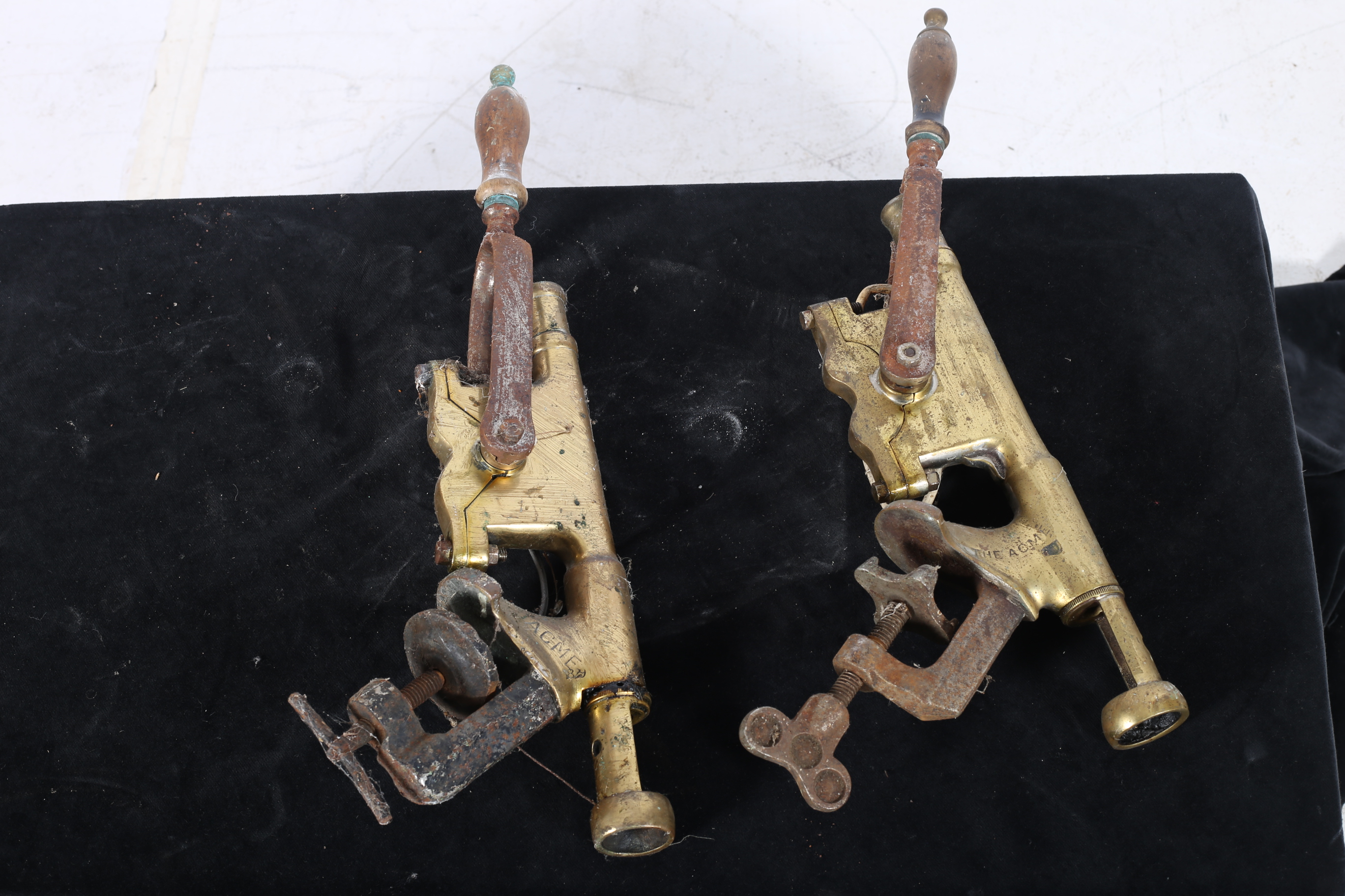 TWO 19TH CENTURY BRASS AND STEEL COUNTER MOUNTED CORK PULLERS inscribed ACME