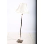 A BRASS FLOOR STANDARD LAMP with reeded column above a square stepped base with shade 168cm (h)