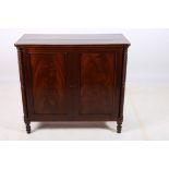 A 19TH CENTURY MAHOGANY SIDE CABINET of rectangular outline the shaped top above a pair of panelled