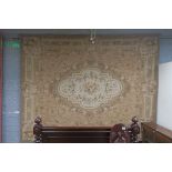A MONGOLIAN TAPESTRY the beige ground decorated overall with flower heads foliage and C scrolls