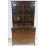 A FINE GEORGIAN MAHOGANY INLAID SECRETAIRE BOOKCASE the moulded cornice above a pair of astragal