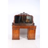 A 19TH CENTURY MAHOGANY MIRRORED BACK PEDESTAL SIDEBOARD the moulded frame with carved decoration